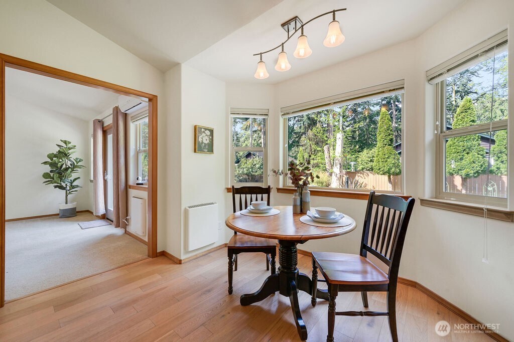 4919 Bell Street Port Townsend, WA 98368 - Photo 20 of 40 a view of a dining room with furniture window and wooden floor