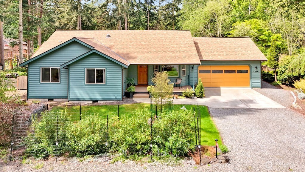 4919 Bell Street Port Townsend, WA 98368 - Photo 2 of 40 a front view of house with yard and green space