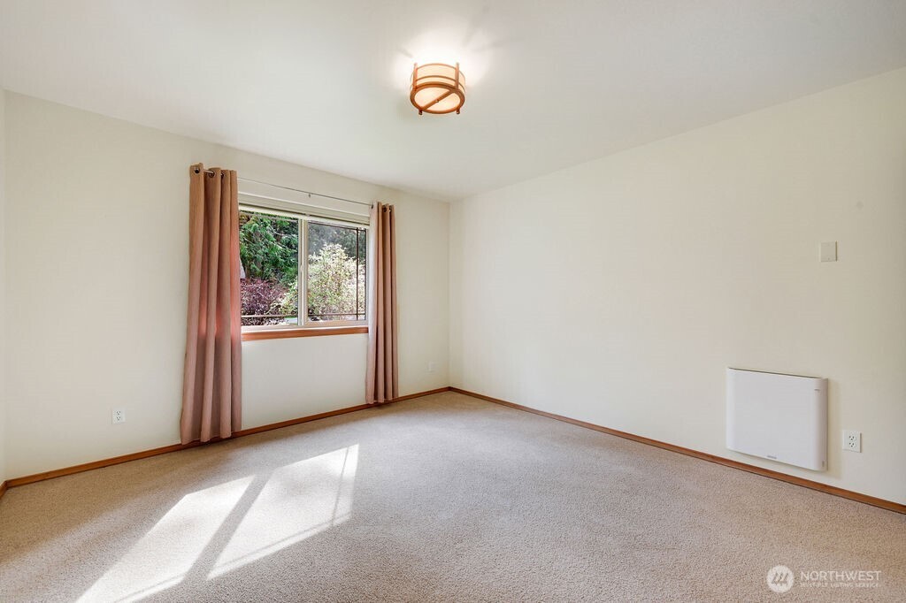 4919 Bell Street Port Townsend, WA 98368 - Photo 22 of 40 a view of an empty room with a window