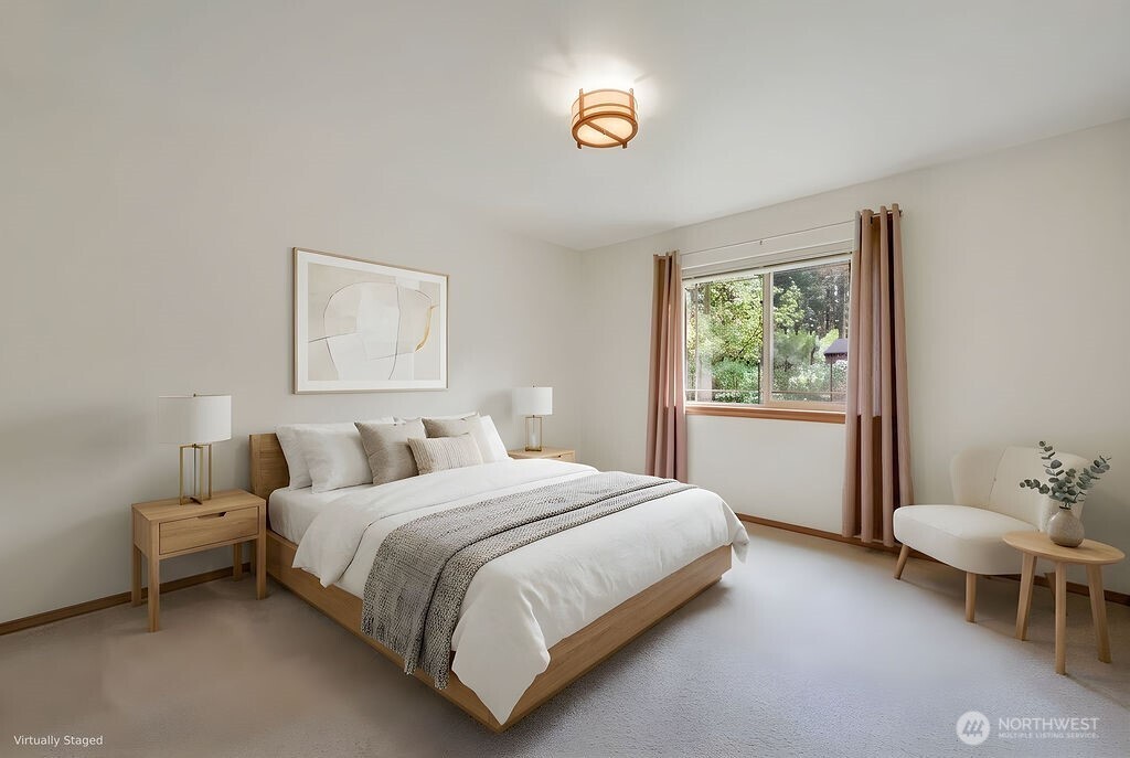 4919 Bell Street Port Townsend, WA 98368 - Photo 23 of 40 a bedroom with a bed and a window