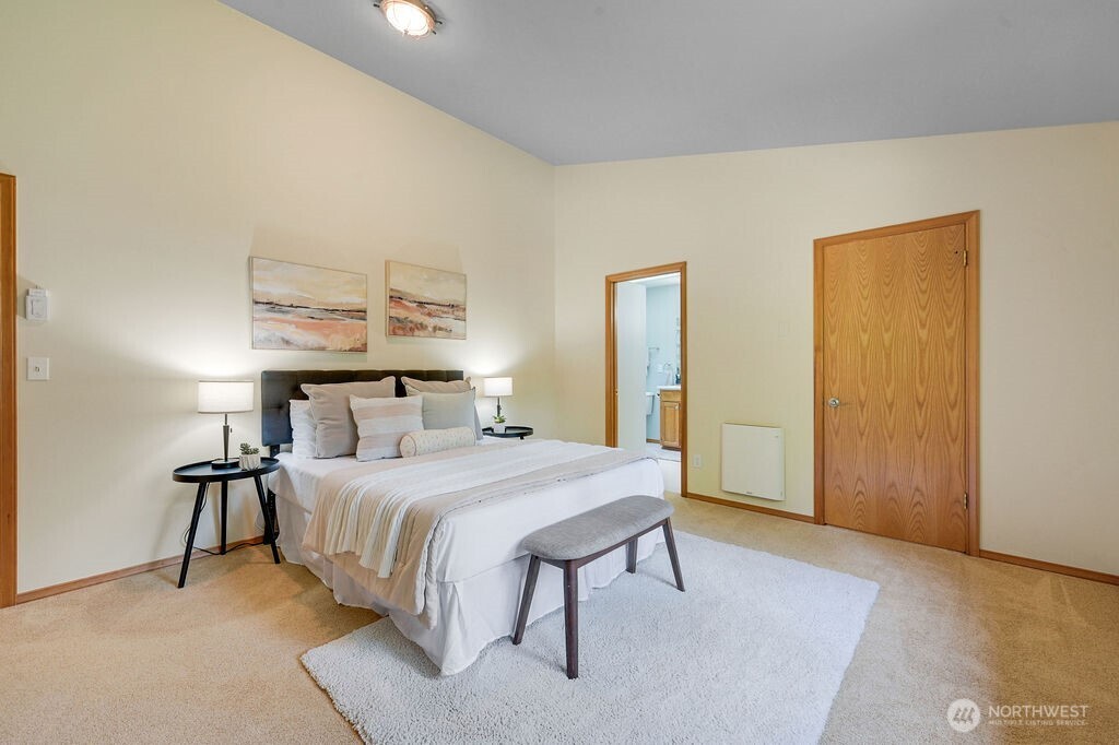 4919 Bell Street Port Townsend, WA 98368 - Photo 30 of 40 a bedroom with a bed and a table