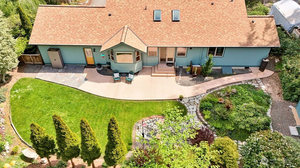4919 Bell Street Port Townsend, WA 98368 - Photo 35 of 40 a aerial view of a house with swimming pool garden and patio