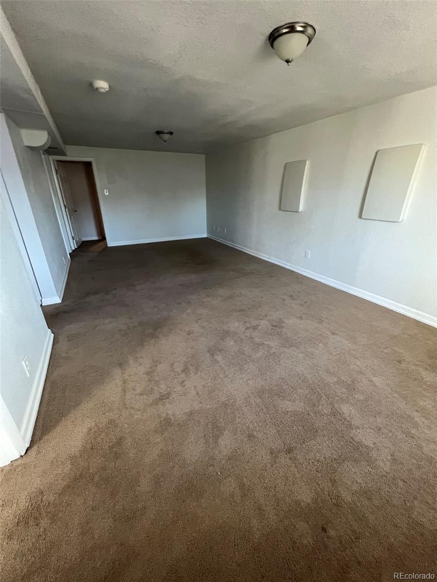 1245 Yates Street Denver, CO 80204 - Photo 17 of 24 a view of a livingroom with an empty space