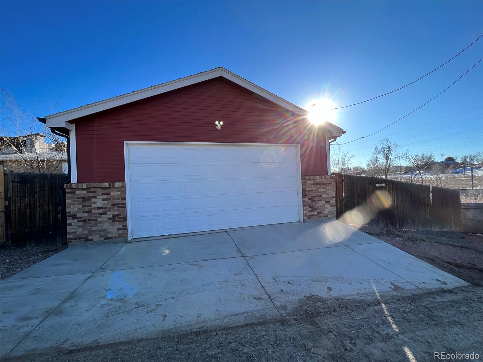 1245 Yates Street Denver, CO 80204 - Photo 22 of 24 a view of a house with a yard