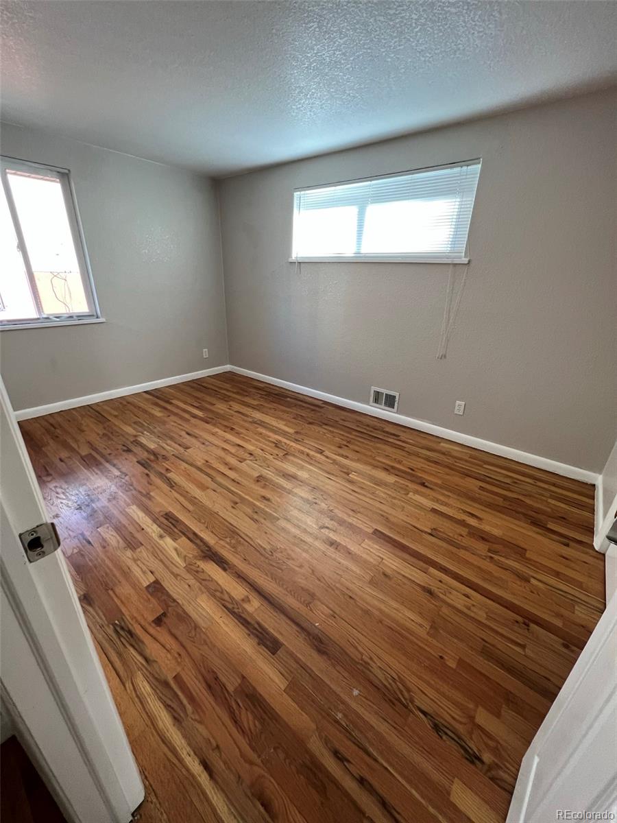 1245 Yates Street Denver, CO 80204 - Photo 6 of 24 wooden floor and window in a room