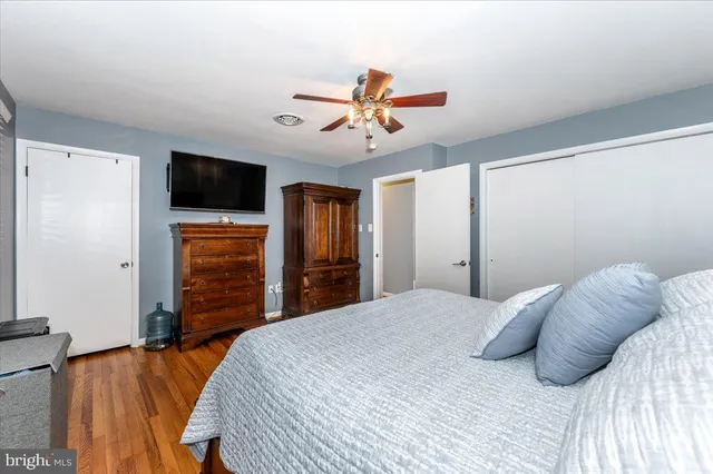 a bedroom with bed and a window