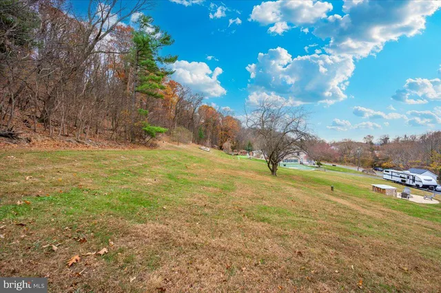 a view of a patio with table and chairs