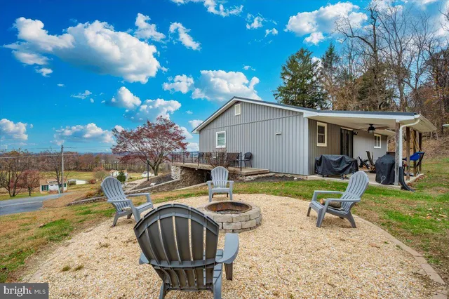 a view of a patio with a table and chairs