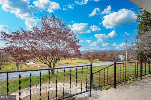 a view of a backyard with a fence