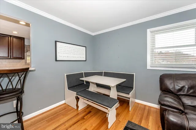 a reading room with furniture and a window