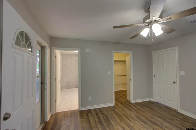 wooden floor in an empty room with a mirror