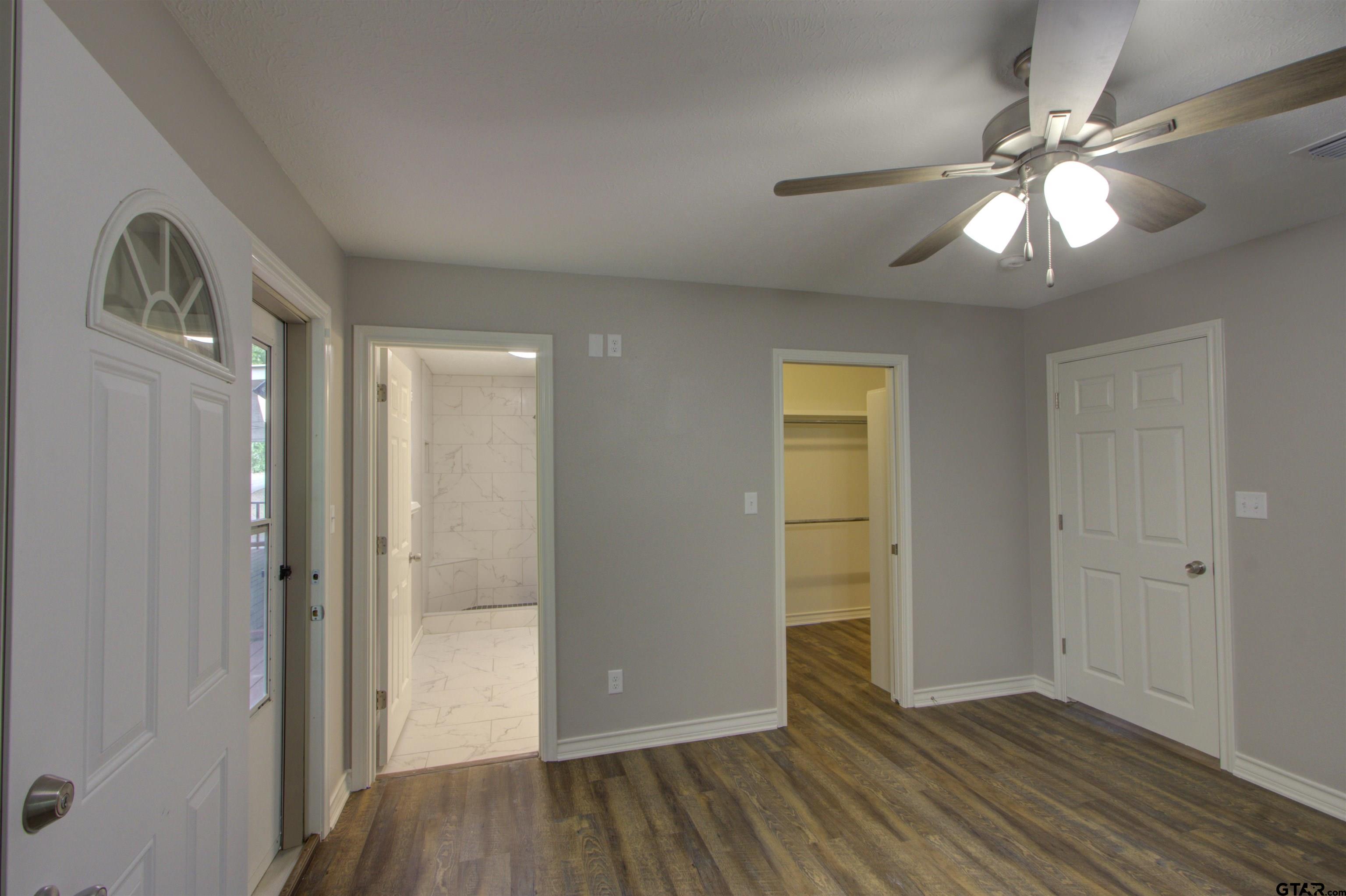 720 Tennessee Acres Drive Texarkana Ar, AR 71854 - Photo 12 of 31 wooden floor in an empty room with a mirror