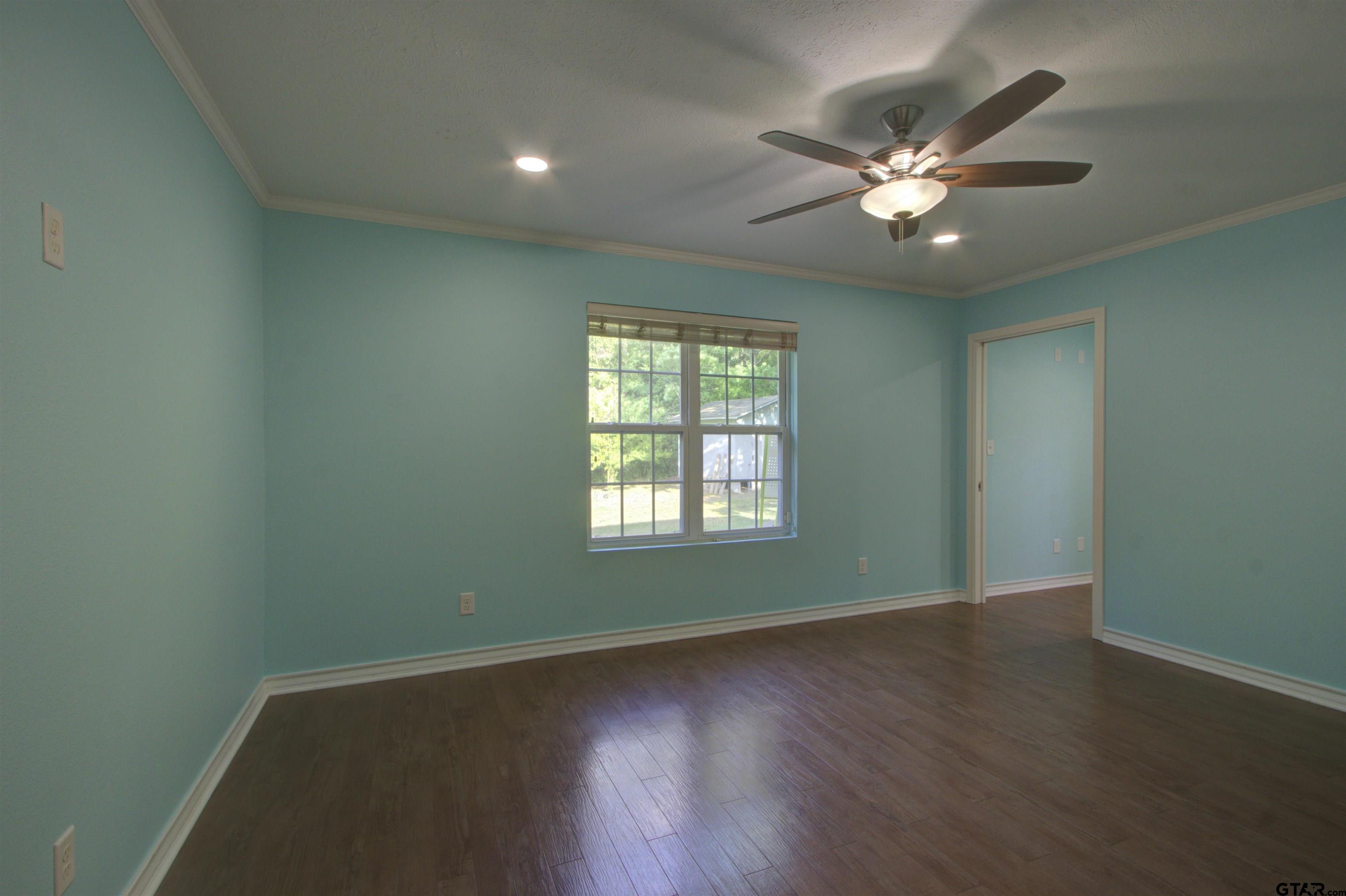 720 Tennessee Acres Drive Texarkana Ar, AR 71854 - Photo 20 of 31 a view of an empty room with wooden floor and a window