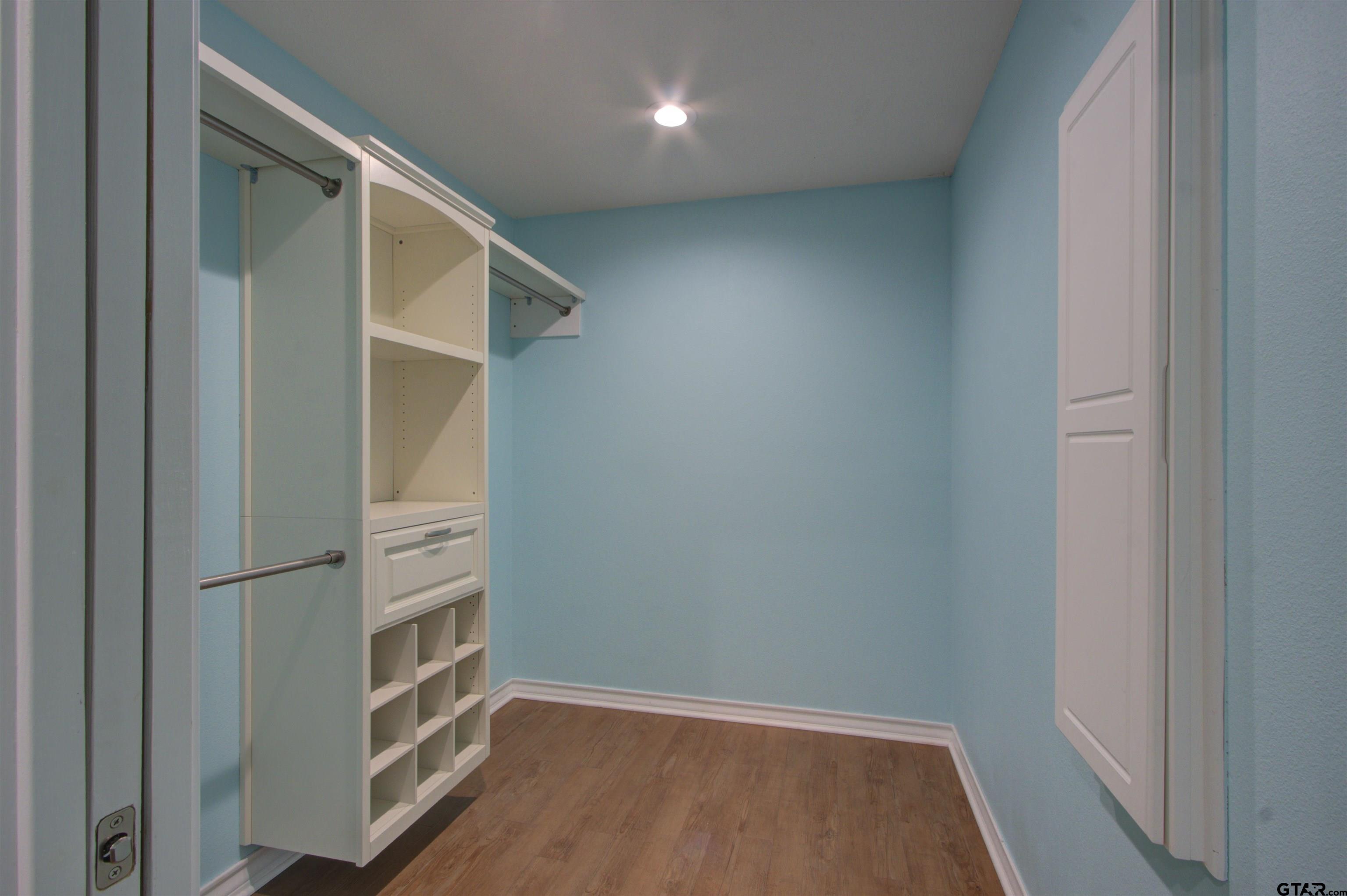 720 Tennessee Acres Drive Texarkana Ar, AR 71854 - Photo 22 of 31 an empty room with wooden floor and closet