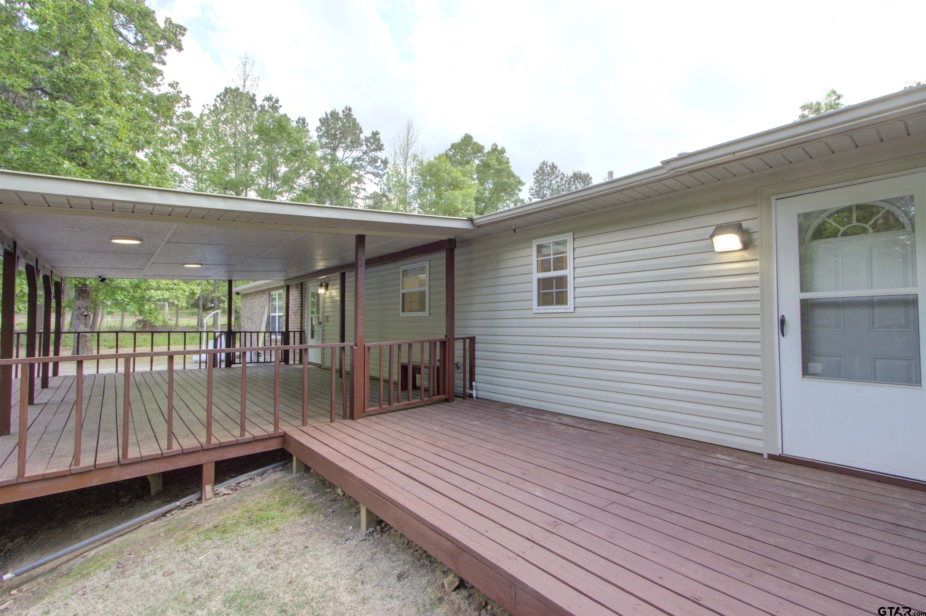 720 Tennessee Acres Drive Texarkana Ar, AR 71854 - Photo 24 of 31 a backyard of a house with a fountain