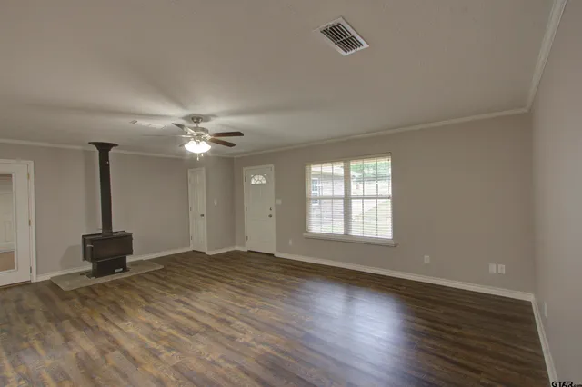 a view of an empty room with a window