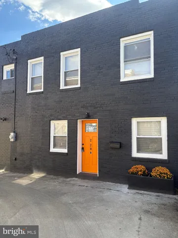 a view of a brick wall and windows