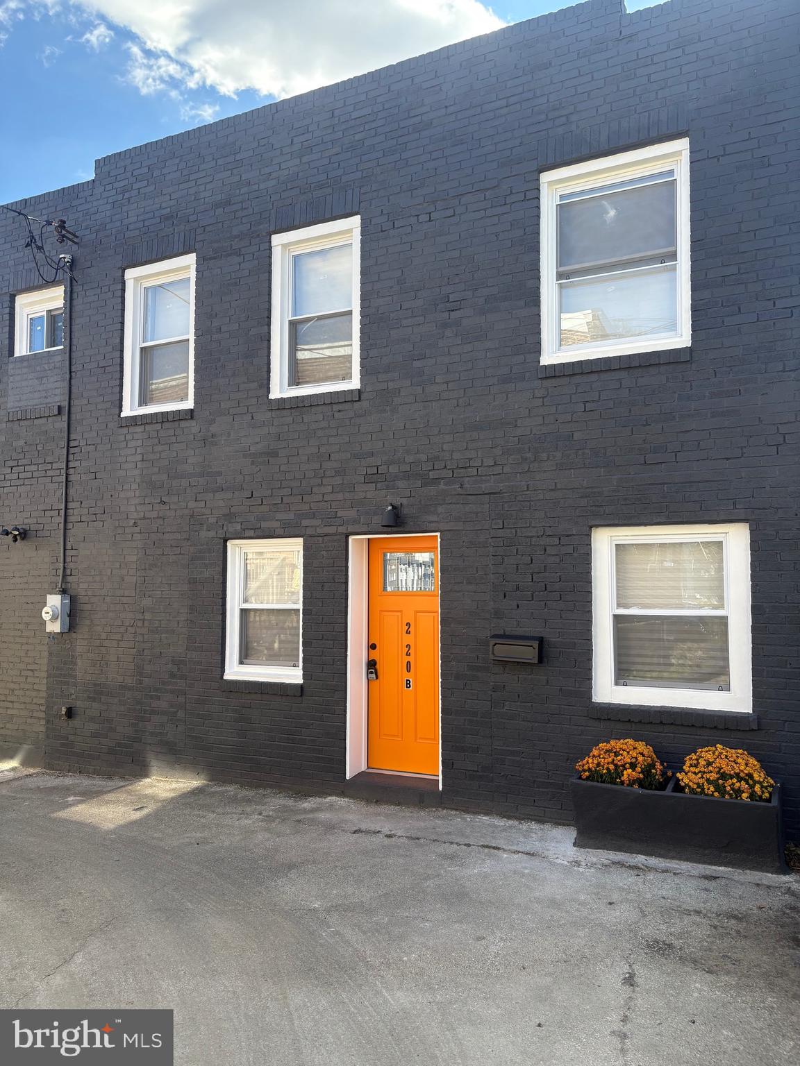 a view of a brick wall and windows