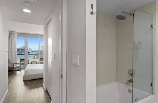 a bathroom with a bathtub and a shower