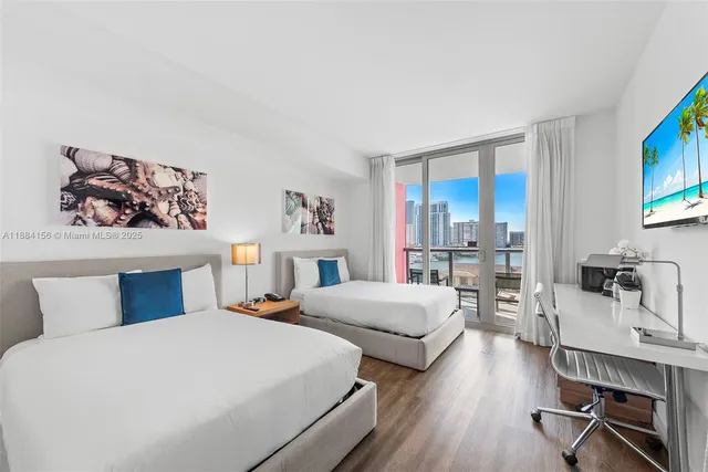 a bedroom with a large bed and a lamp