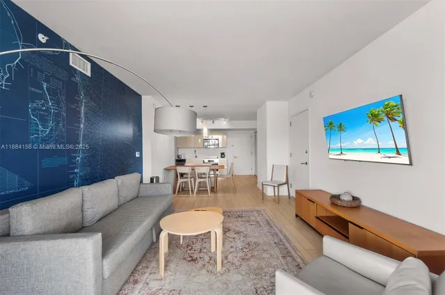 a living room with furniture and a rug