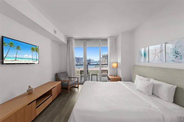 a bed room with a bed and a lamp