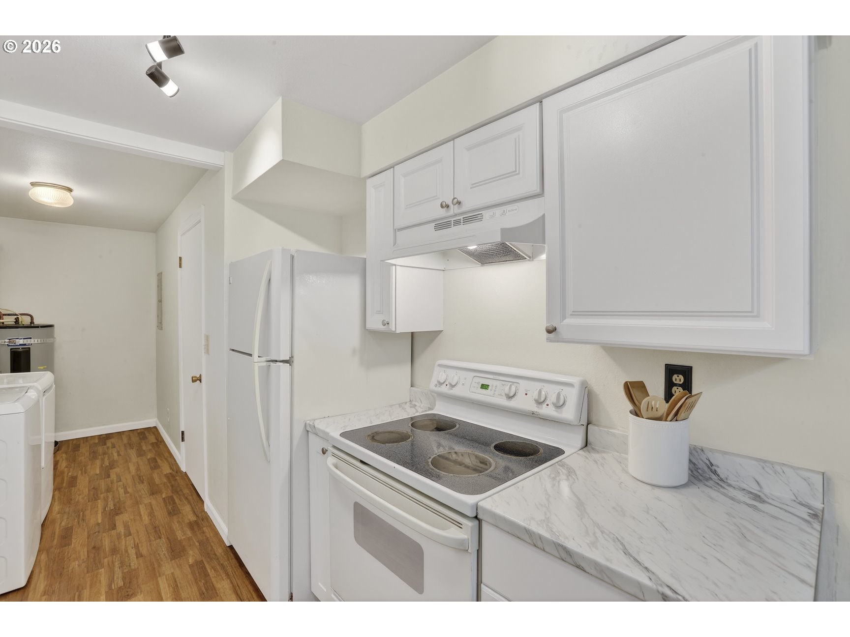 290 North 4th Street St. Helens, OR 97051 - Photo 13 of 26 a utility room with cabinets washer and dryer