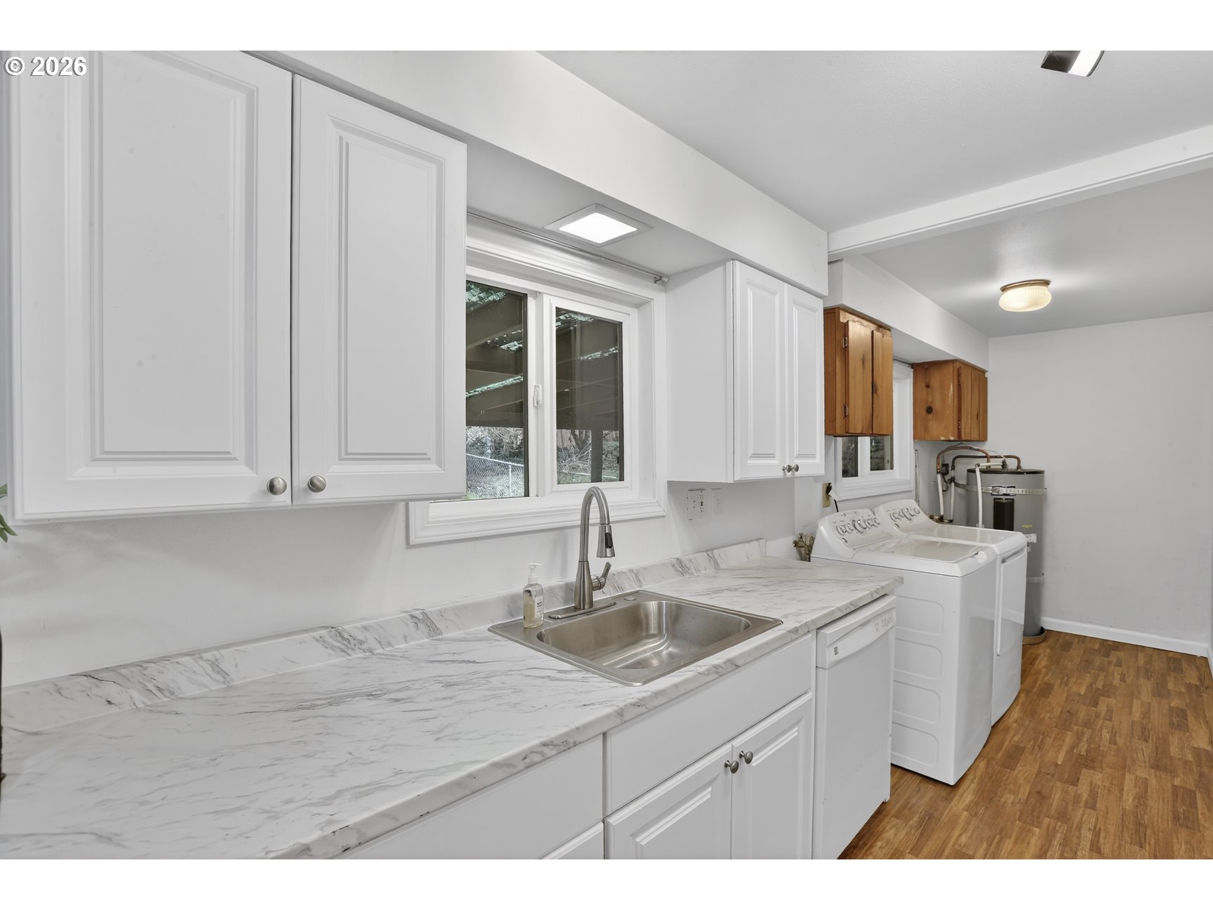 290 North 4th Street St. Helens, OR 97051 - Photo 14 of 26 a kitchen with a sink cabinets and window