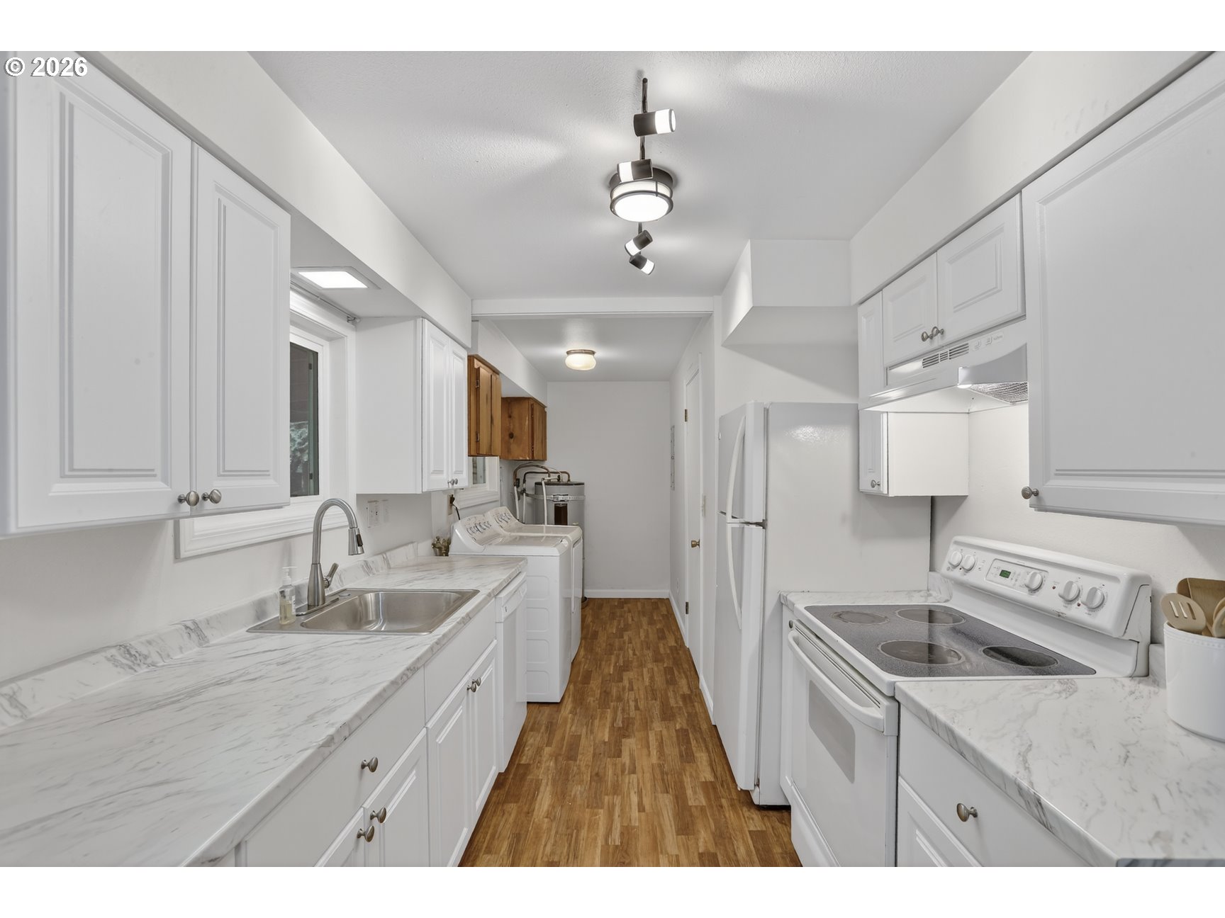 290 North 4th Street St. Helens, OR 97051 - Photo 15 of 26 a kitchen with a sink stove and refrigerator