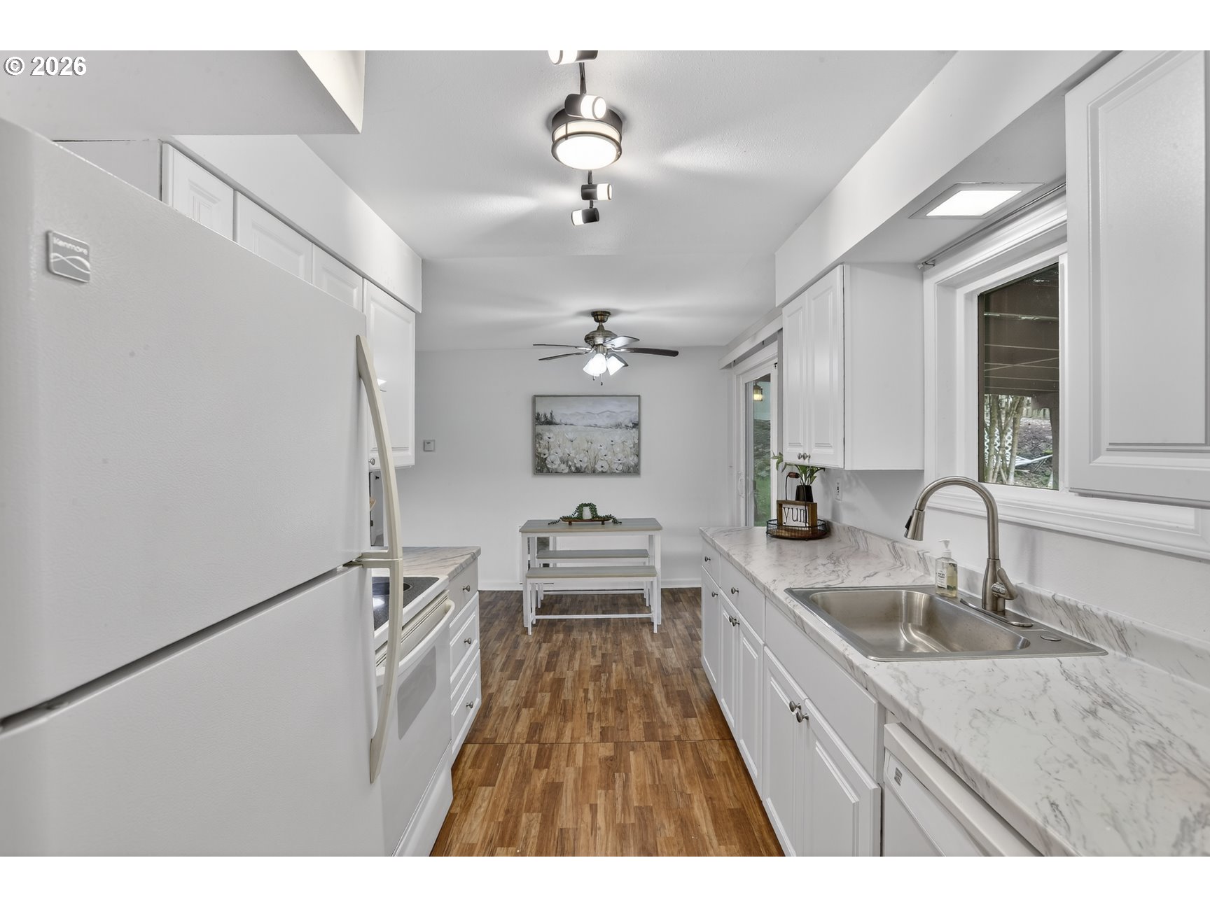 290 North 4th Street St. Helens, OR 97051 - Photo 16 of 26 a large white kitchen with sink and stainless steel appliances