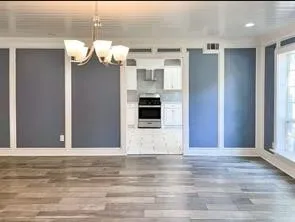 a view of a livingroom with wooden floor