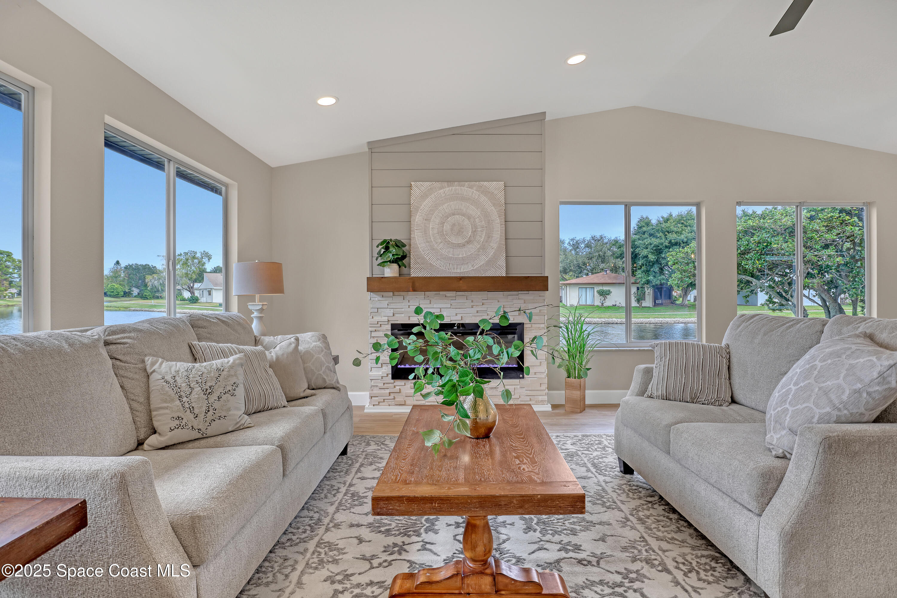 443 Myrtlewood Road Melbourne, FL 32940 - Photo 13 of 72 a living room with furniture and a large window