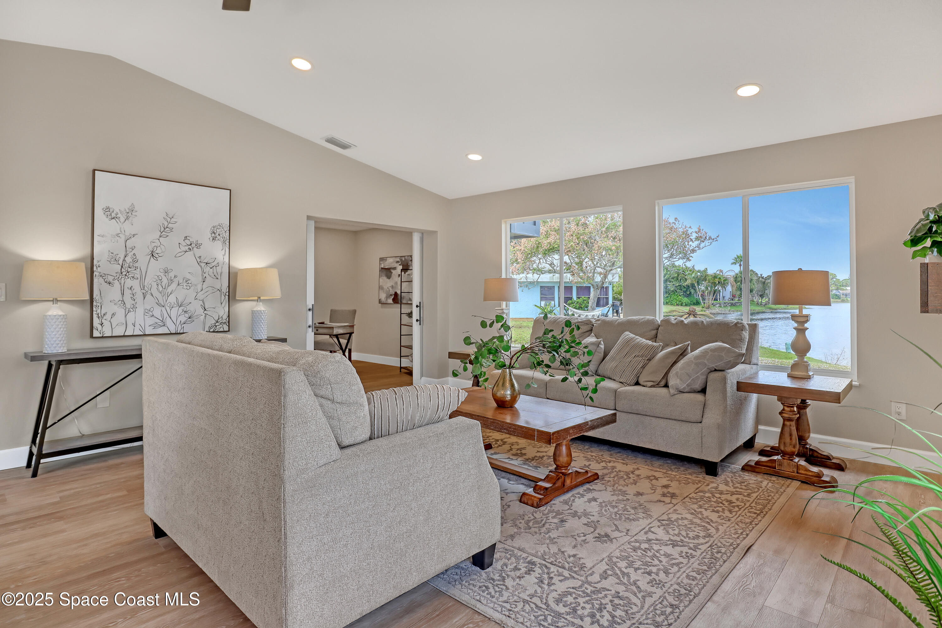 443 Myrtlewood Road Melbourne, FL 32940 - Photo 15 of 72 a living room with furniture and a couch