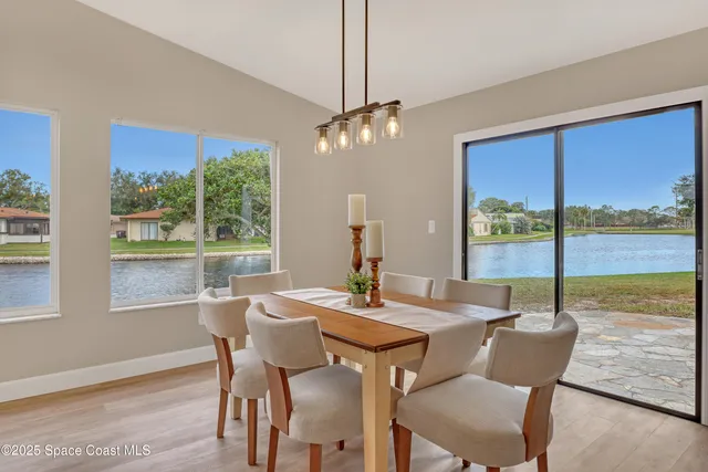 a view of a floor to ceiling window and a yard