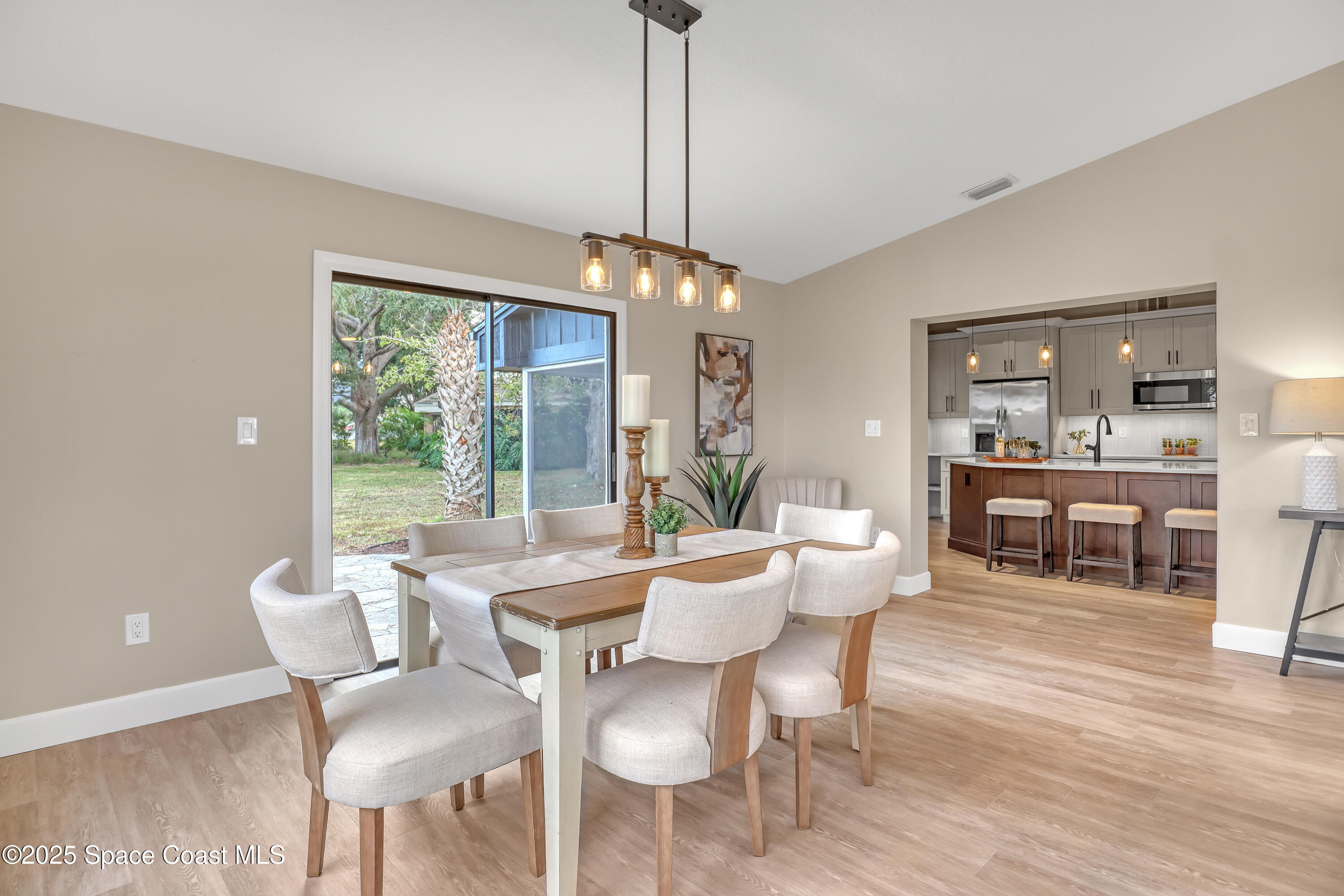 443 Myrtlewood Road Melbourne, FL 32940 - Photo 17 of 72 a dining room with furniture window and wooden floor