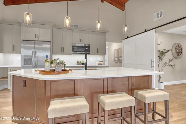 a kitchen with a stove and a sink