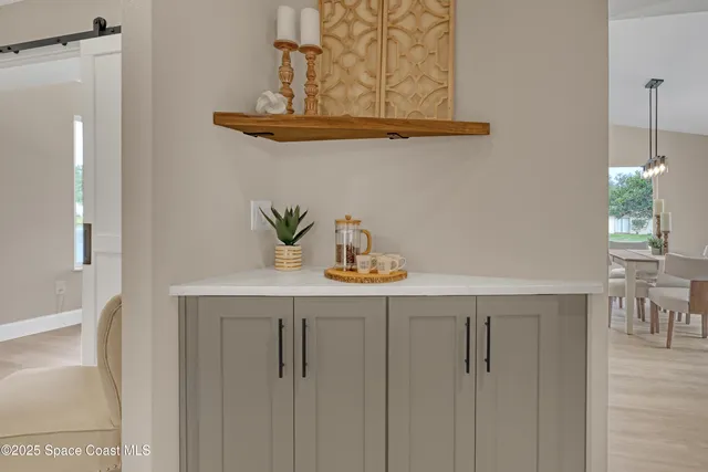 a view of a patio with a table chairs and backyard