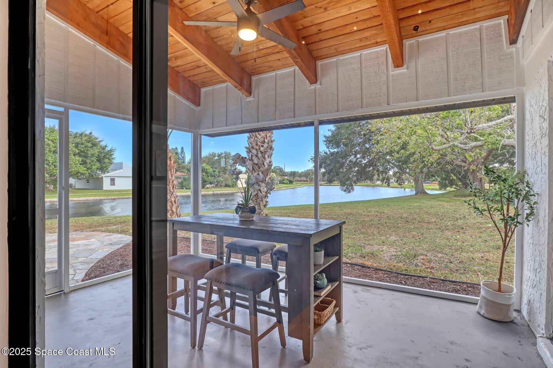 443 Myrtlewood Road Melbourne, FL 32940 - Photo 35 of 72 a view of a patio with a table chairs and backyard