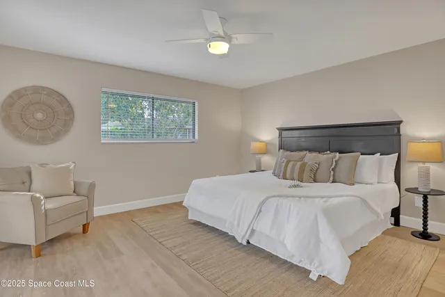 a view of a chairs and table in balcony