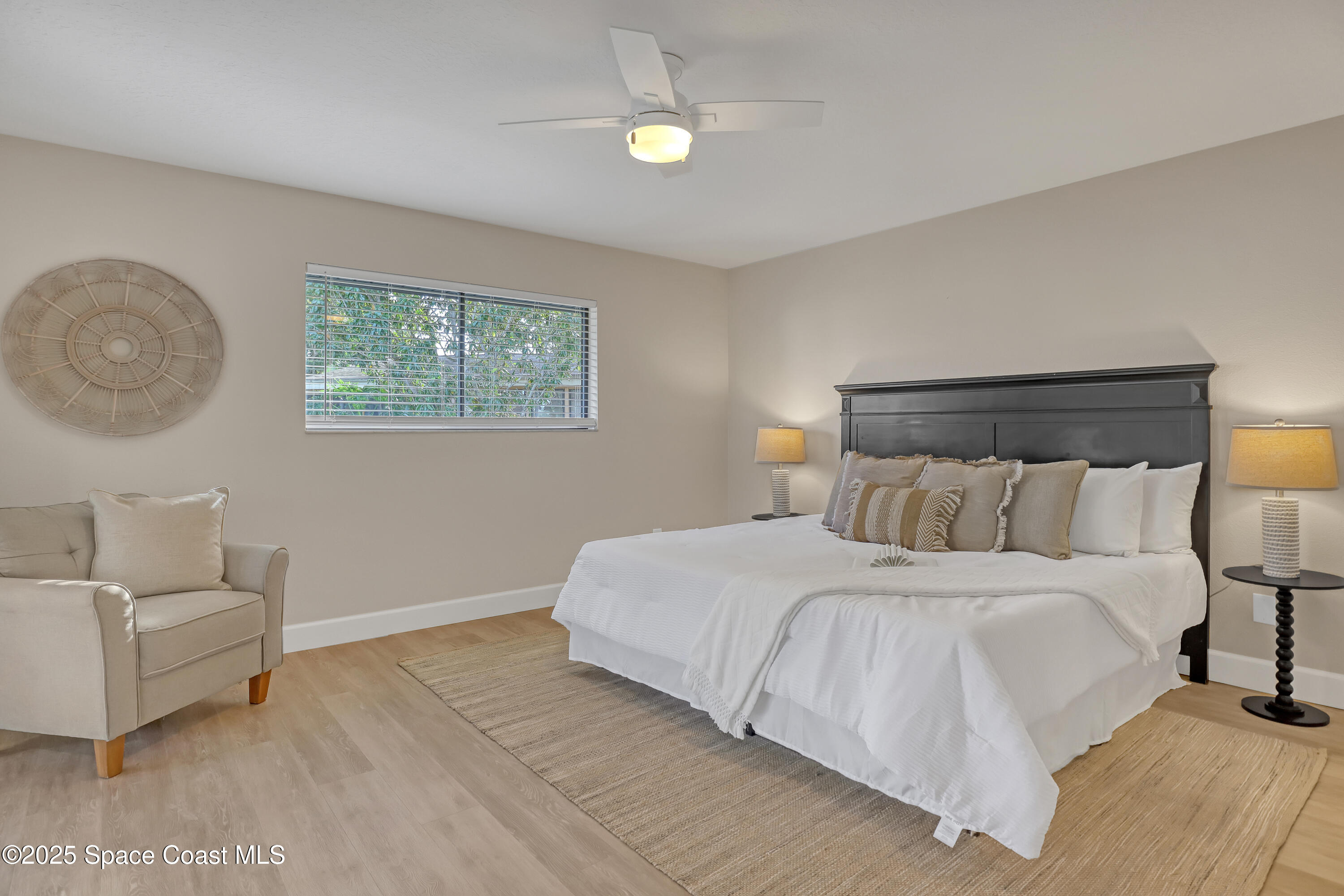 443 Myrtlewood Road Melbourne, FL 32940 - Photo 41 of 72 a bedroom with a bed and a couch