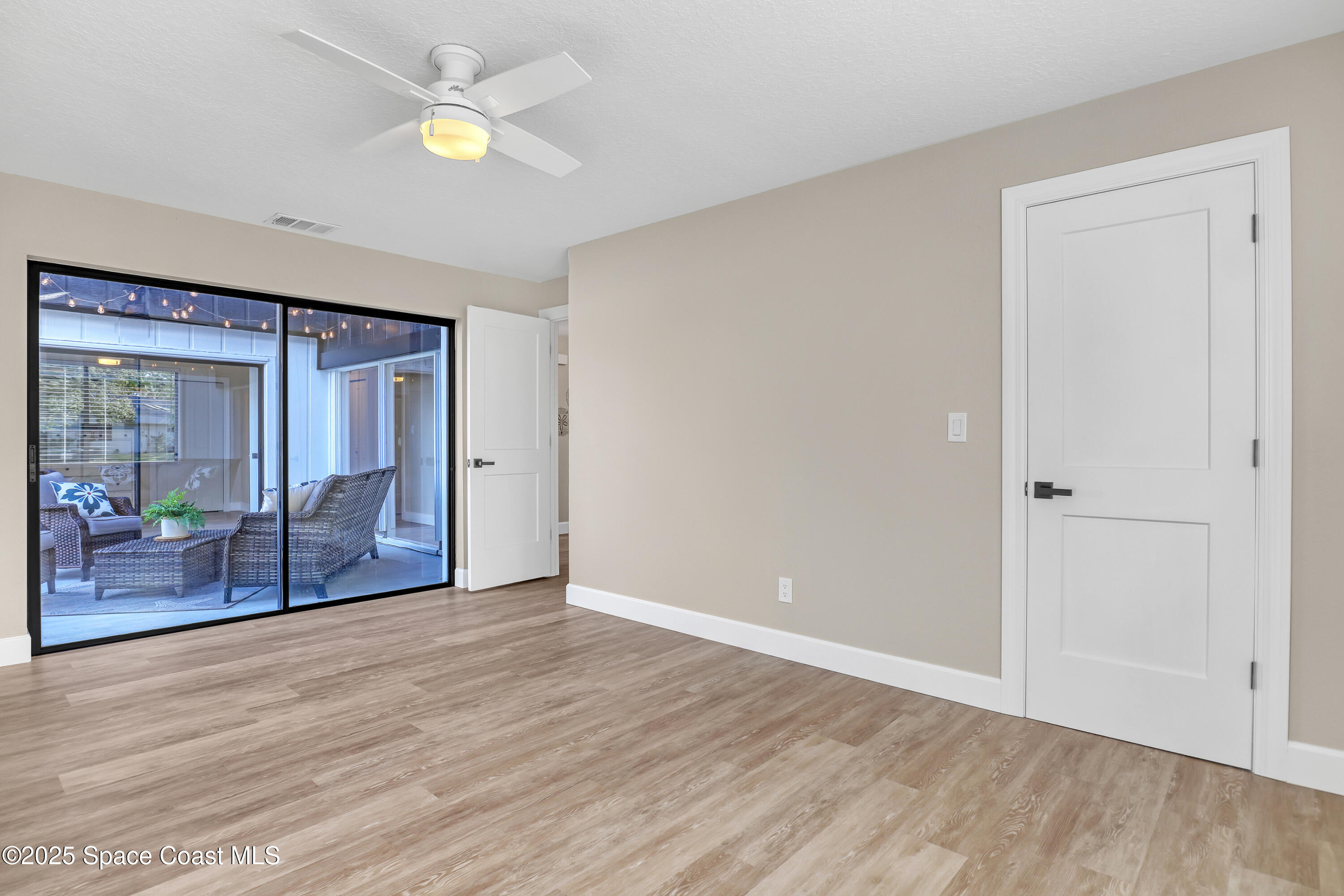 443 Myrtlewood Road Melbourne, FL 32940 - Photo 49 of 72 wooden floor in an empty room with a window