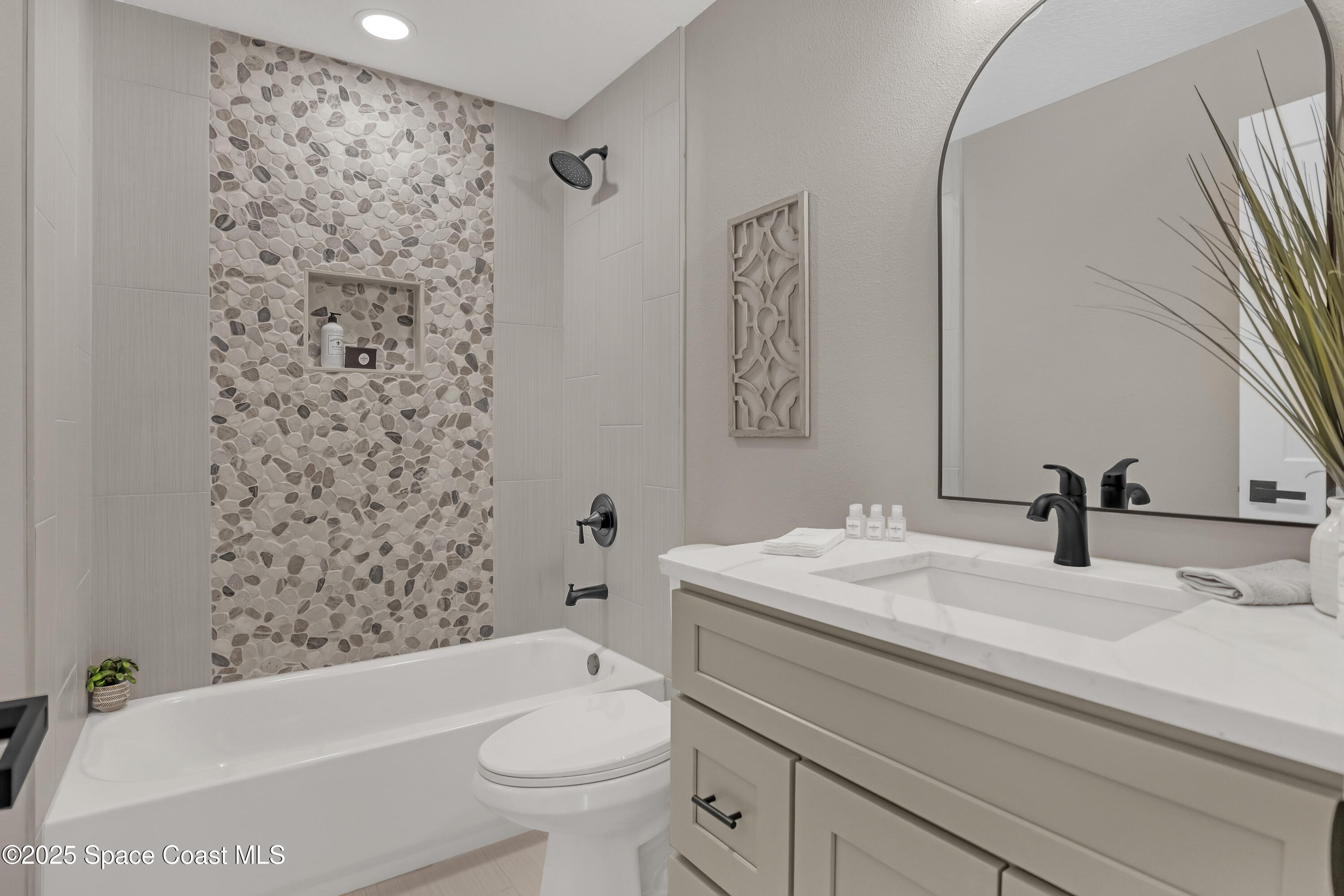 443 Myrtlewood Road Melbourne, FL 32940 - Photo 51 of 72 a bathroom with a sink toilet and shower