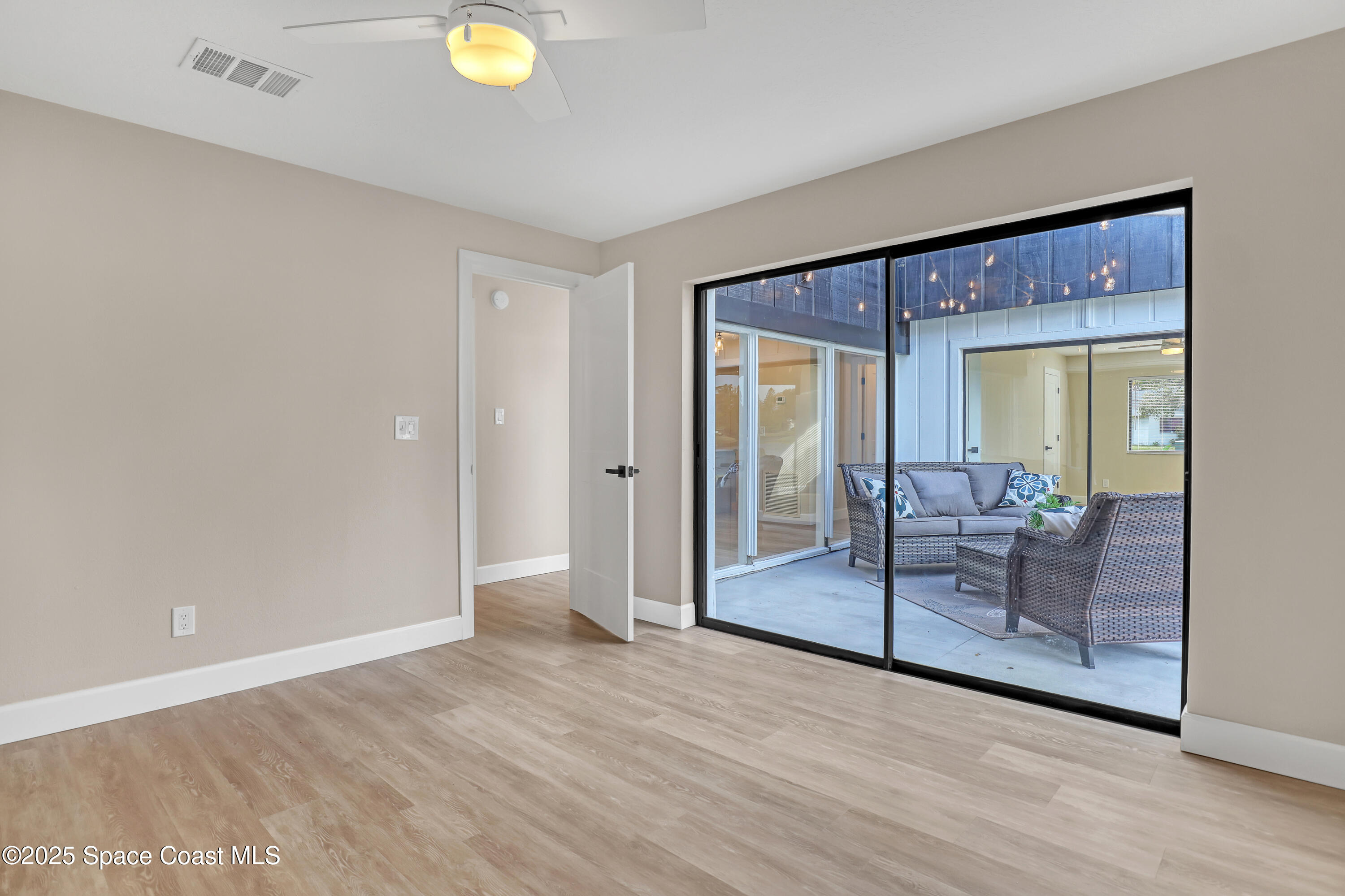 443 Myrtlewood Road Melbourne, FL 32940 - Photo 53 of 72 a view of livingroom with furniture wooden floor and window