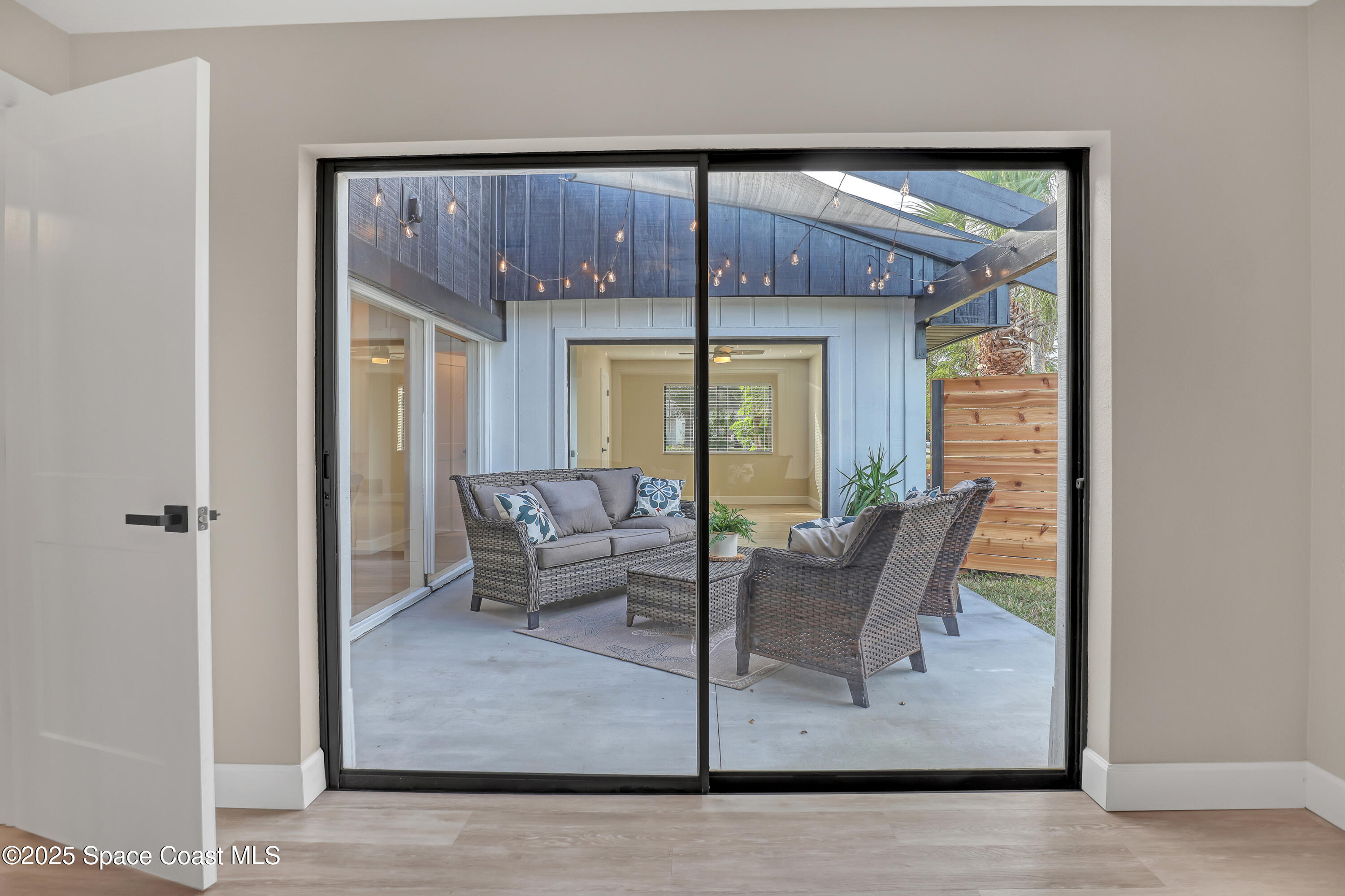 443 Myrtlewood Road Melbourne, FL 32940 - Photo 54 of 72 Guest bedroom #2 slider door to atrium