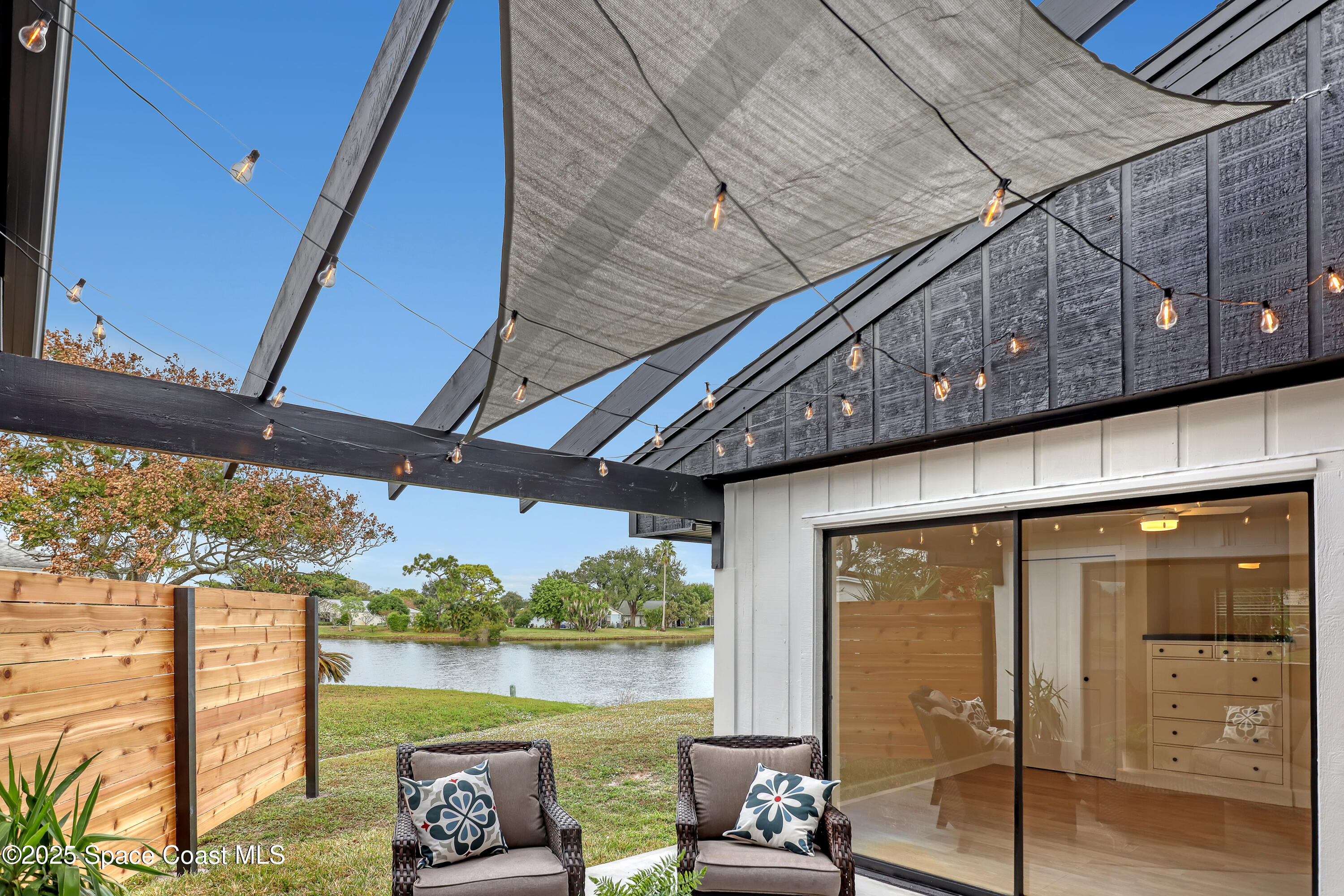 443 Myrtlewood Road Melbourne, FL 32940 - Photo 55 of 72 a view of a chairs and table in balcony