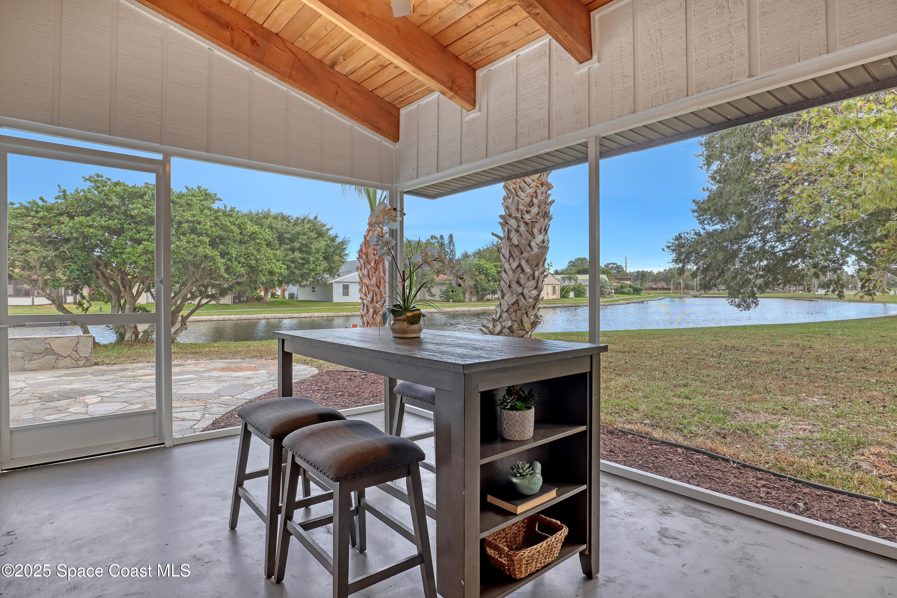 443 Myrtlewood Road Melbourne, FL 32940 - Photo 59 of 72 Screened patio with wood beam ceiling
