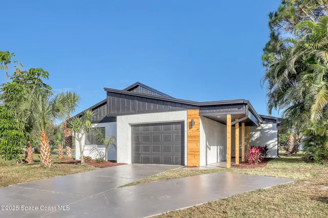 a front view of a house with a garage
