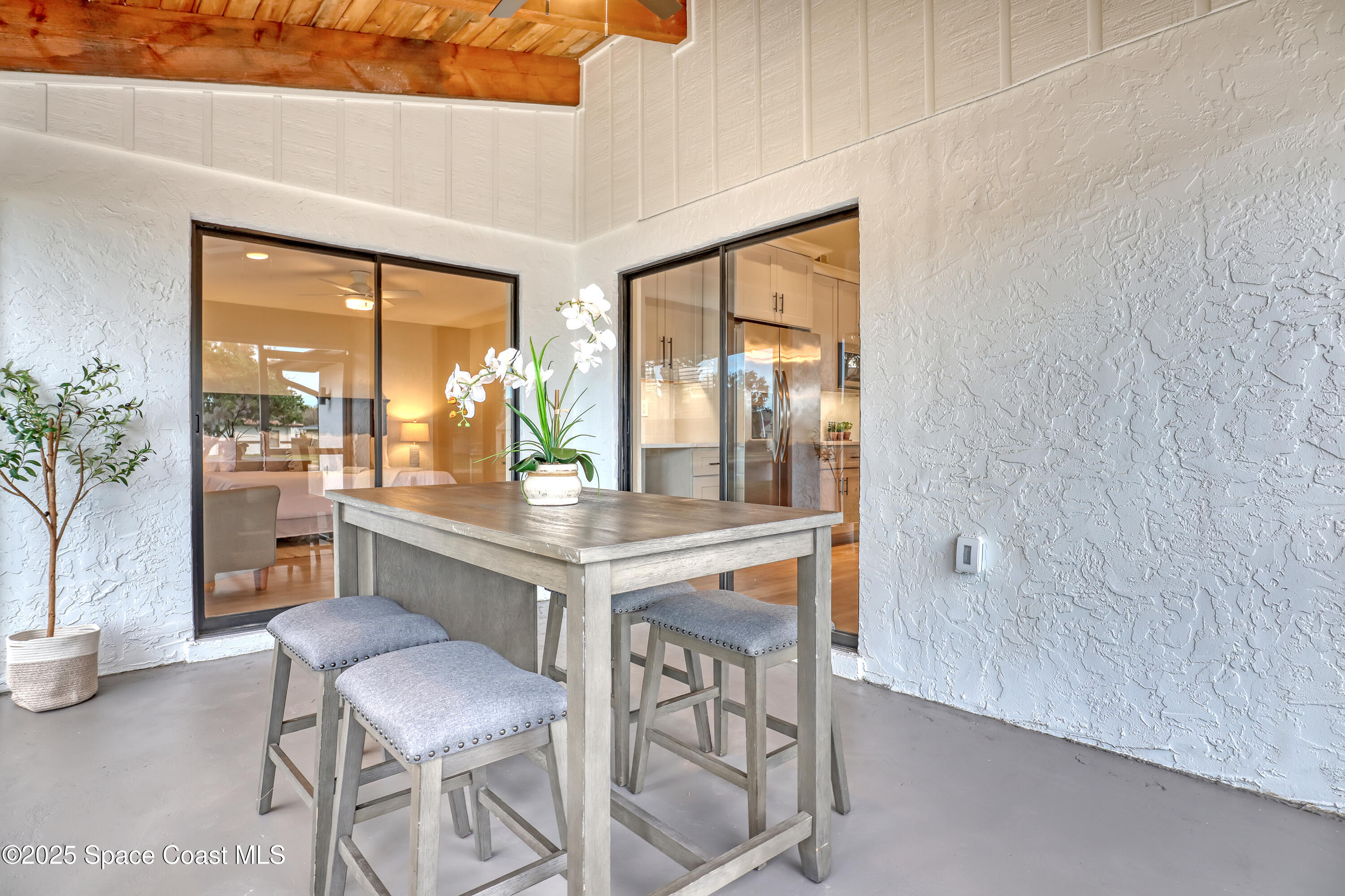 443 Myrtlewood Road Melbourne, FL 32940 - Photo 61 of 72 Screened patio with wood beam ceiling