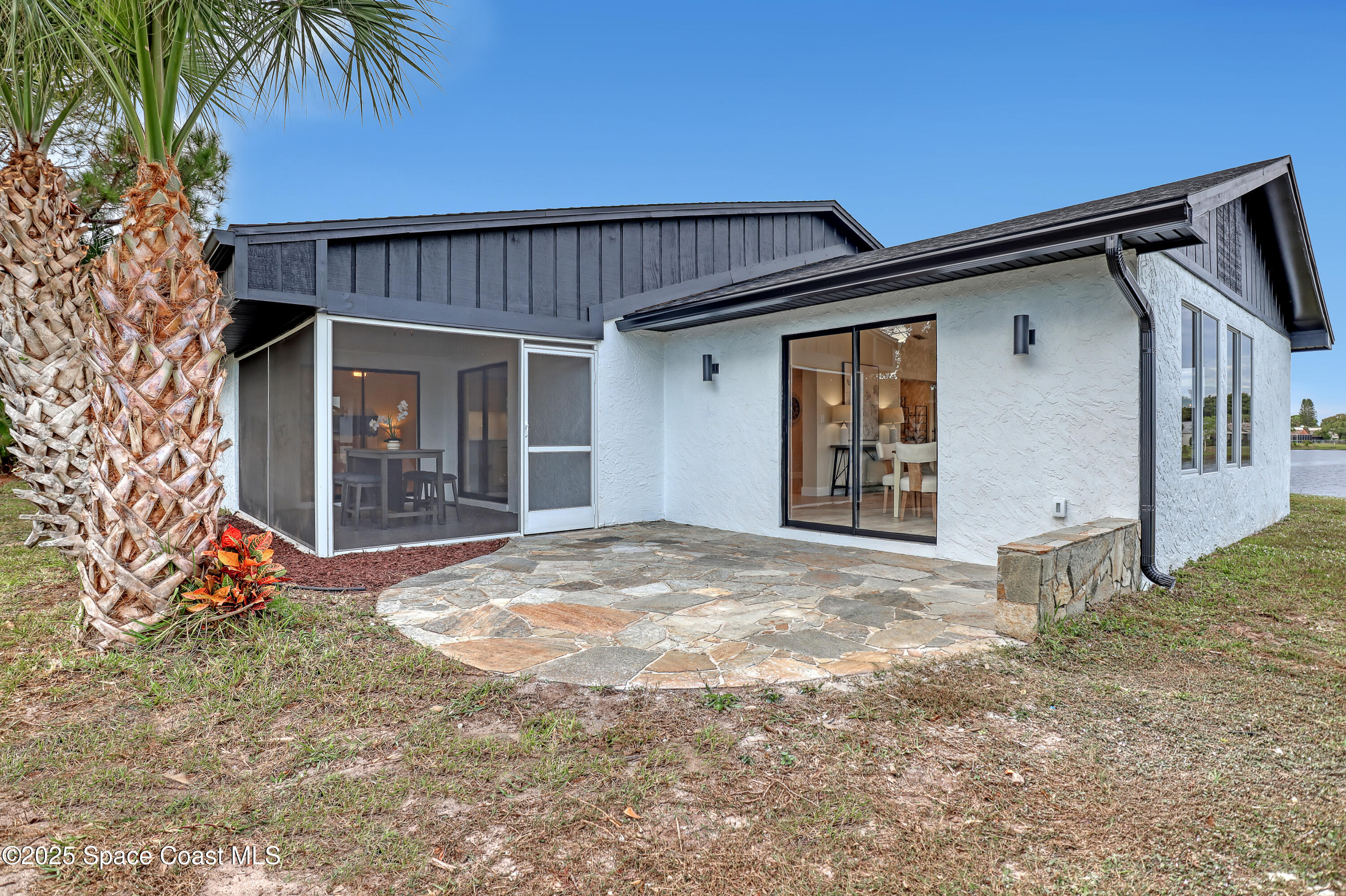 443 Myrtlewood Road Melbourne, FL 32940 - Photo 62 of 72 a front view of a house with garden