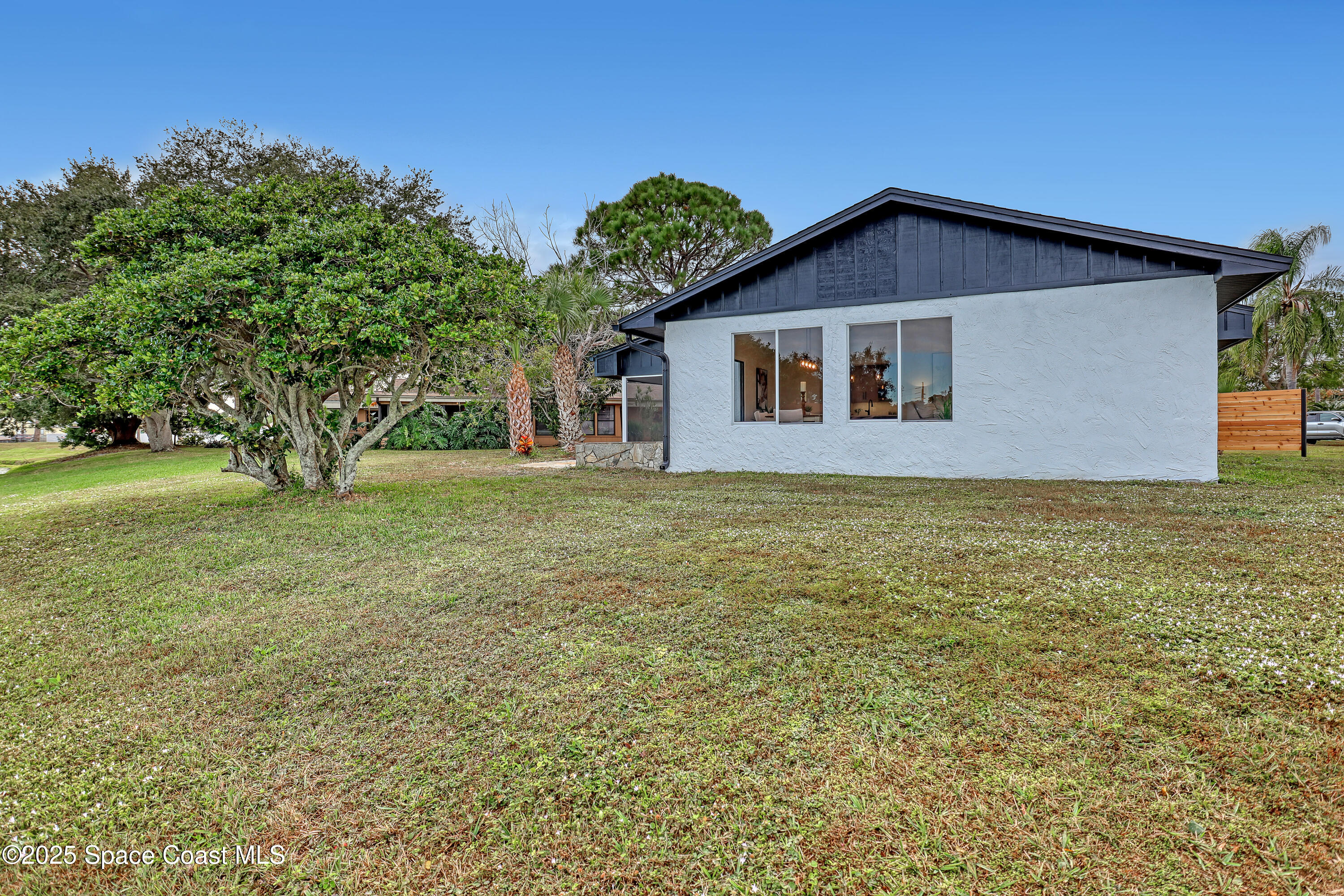 443 Myrtlewood Road Melbourne, FL 32940 - Photo 64 of 72 a front view of house with yard and trees all around